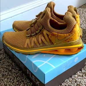 Gold Nikes size 6
